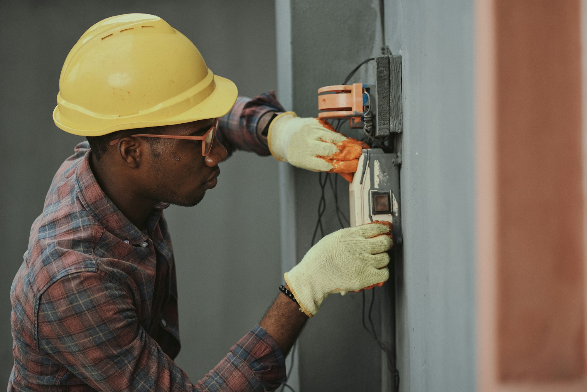 Electrician installing wiring in an electrical panel
